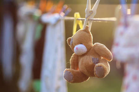 toy clothesline clothespin sunset time in autumnの写真素材