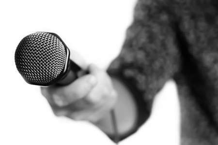Microphone isolated in singing man handの写真素材