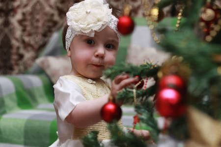 children family decorate the Christmas tree toyの写真素材