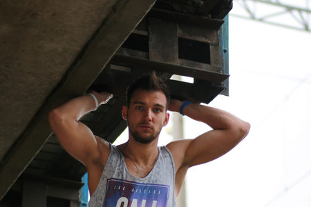 bearded man under bridge