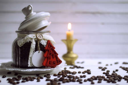 coffee bean in glass bowl on white wooden tableの写真素材