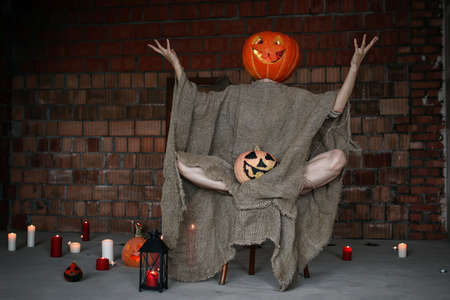 pumpkin head monster horror indoor brick wallの写真素材