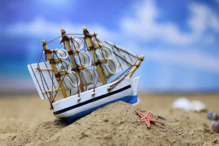 sand shell and sail in sea backgroundの写真素材