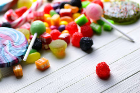 sweet candy jelly bean on a white wooden backgroundの写真素材