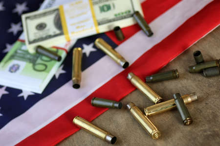bullet and money on the american flagの写真素材