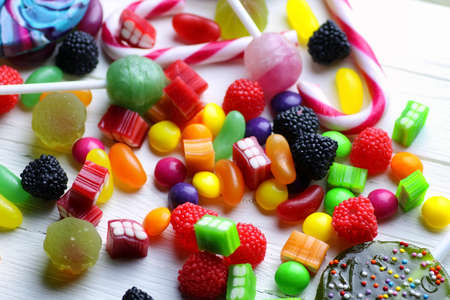 sweet candy jelly bean on a white wooden backgroundの写真素材