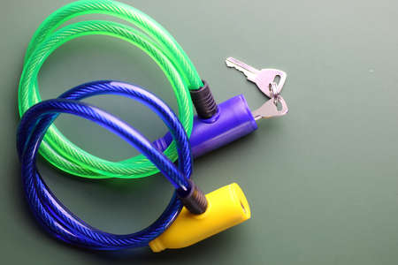bicycle lock with key on a green tableの写真素材