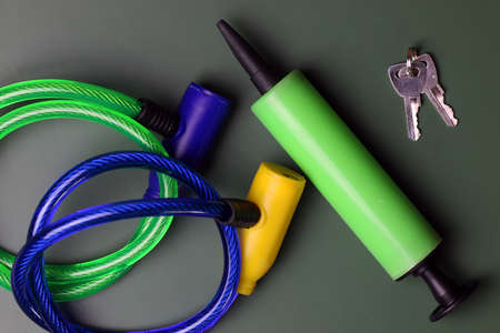 bicycle lock with key on a green tableの写真素材
