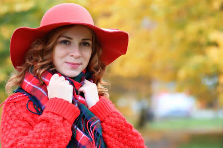 woman wearing red   in a tree parkの写真素材