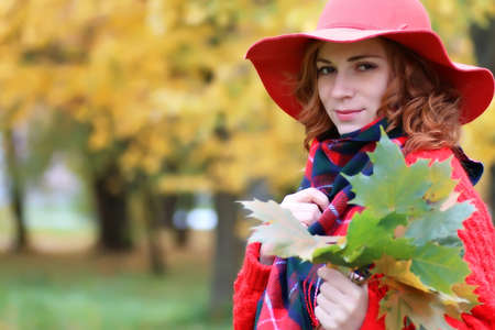 woman wearing red   in a tree parkの写真素材