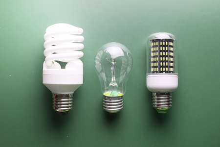 different light bulbs on green tableの写真素材