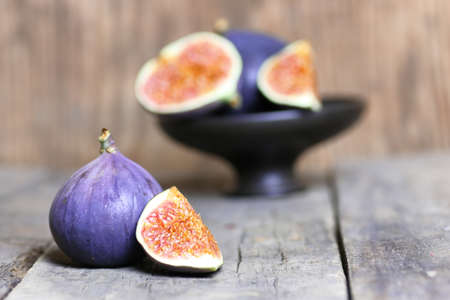 Fresh fig fruit on old wooden backgroundの写真素材