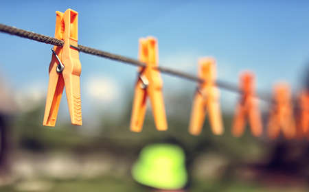 colored clothespin on the rope outdoor landscapeの写真素材