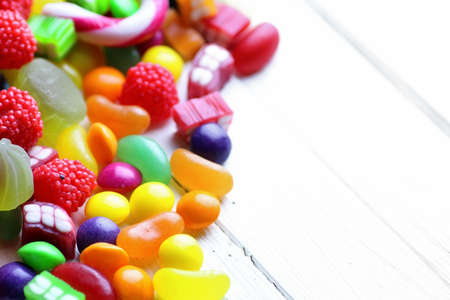 sweet candy on a white wooden backgroundの写真素材