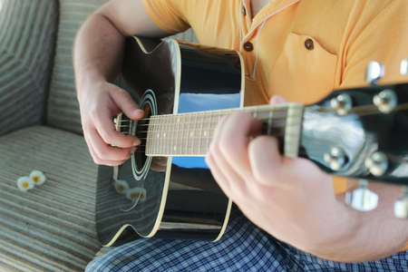 guitar string person hand outdoor playing musicの写真素材