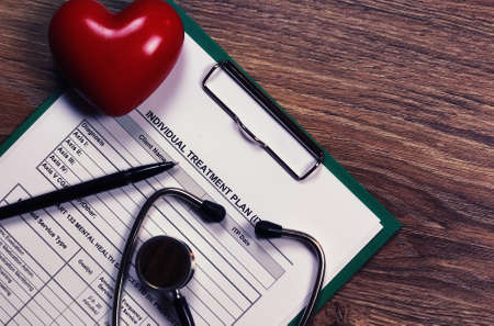 cardiologist stethoscope on paperの写真素材