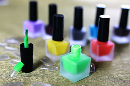 nail polish on golden backgroundの写真素材