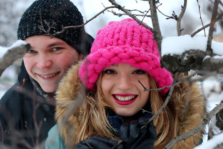 couple in love on a street winter snow