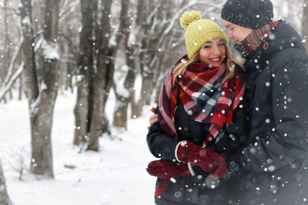 couple in love on a street winter snow
