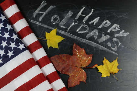 happy holiday text on a chalk boardの写真素材