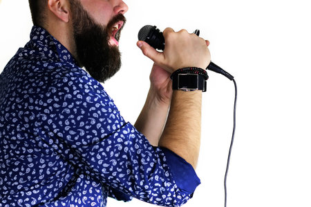 Microphone isolated in singing man hand concept pop music