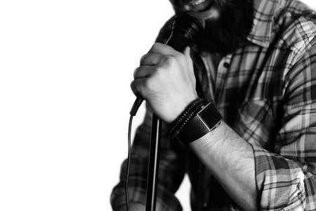 Microphone isolated in singing man hand concept pop music