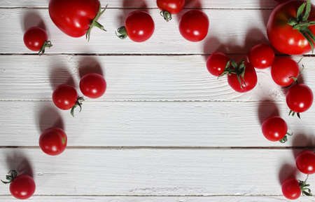 harvest fresh tomato on wooden backgroundの写真素材