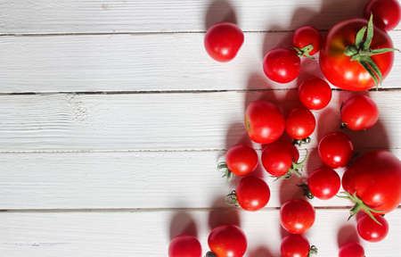 harvest fresh tomato on wooden backgroundの写真素材