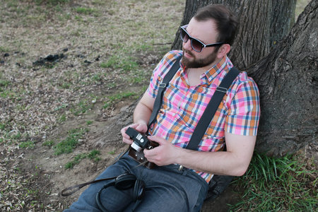 beard man relax at the tree park