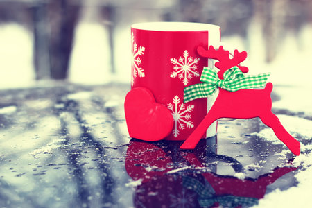 cup of hot drink on winter street