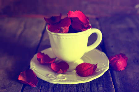 toned photo, tea cup  on old wooden tableの写真素材