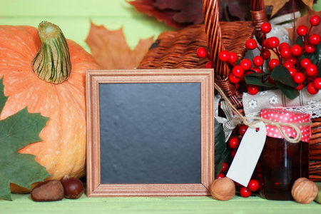 pumpkin on green wooden table with space for textの写真素材