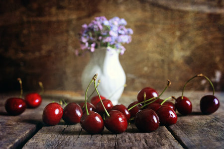 cherry berry on a wooden background retroの写真素材