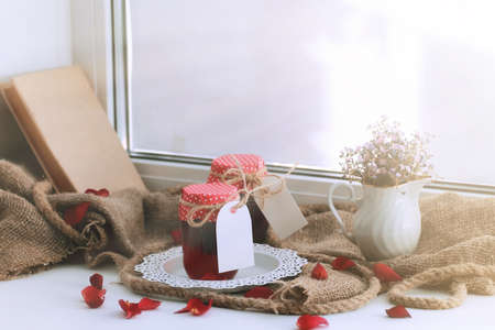 rustic homemade jam and flowerの写真素材