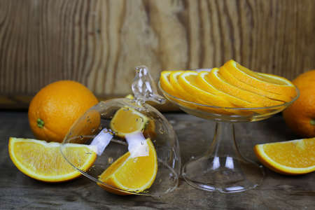 fresh orange cut fruit on wooden backgroundの写真素材