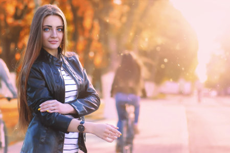 fashion young girl in the autumn parkの写真素材