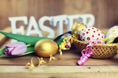 Easter   flower and eggs on wooden backgroundの写真素材