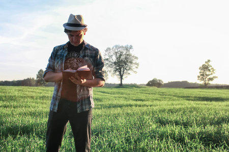 man travelling in nature with backpack outdoor in natureの写真素材