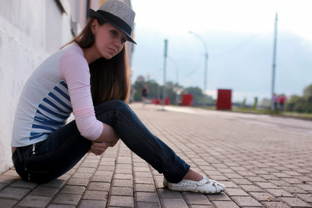 cute girl outdoor read book stone riverの写真素材