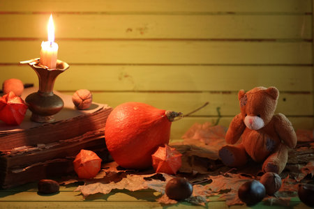 composition pumpkin and lamp on wooden tableの写真素材