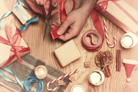 gift packaging hand christmas on a woodの写真素材
