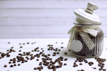 coffee bean in a jar on white backgroundの写真素材