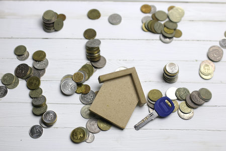 key and russian coins on white background