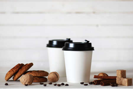 coffee paper cup and coffee bean on tableの写真素材
