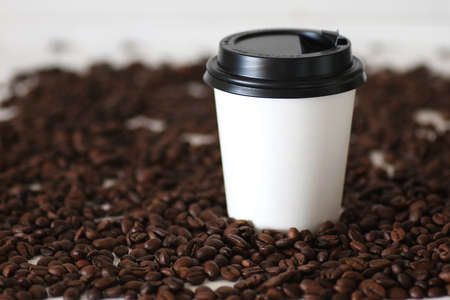 coffe paper cup and coffee bean on tableの写真素材