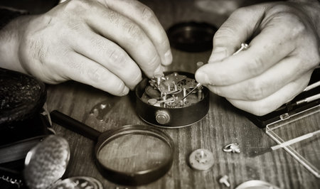 watch clock repairs man working in process