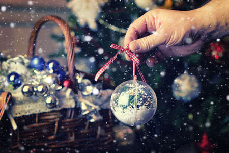 Christmas toys for fir tree in a wicker basketの写真素材