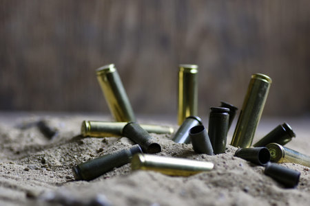 bullet in the sand concept of war in desertの写真素材
