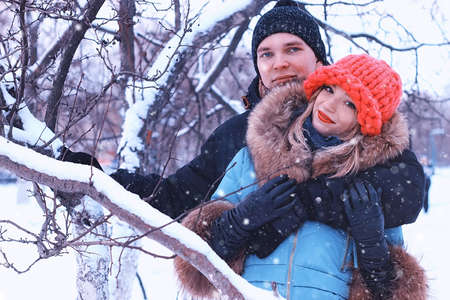 young people outdoor in the park in snowy winterの写真素材