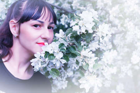 portrait of a cute beautiful girl of European appearance on nature in a summer dayの写真素材